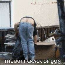 a man is standing in front of a pile of garbage with the words " the butt crack of don " on the bottom