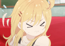 a girl with blonde hair is making a funny face with the letter v on her face
