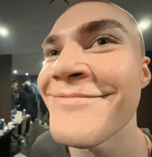 a close up of a man 's face smiling