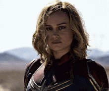 a close up of a woman in a superhero suit