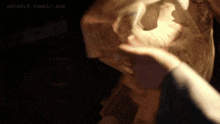 a blurred image of a person 's hand with the website p3ns1v3.tumblr.com in the background