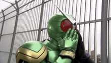 a person in a green masked rider costume