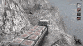 a video game screen shows a truck carrying bricks on the back
