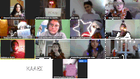 a group of people are on a video call and one of them is holding a sign that says agathi