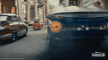 a poster for fantastic four shows cars driving down a street