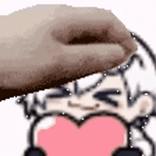 a hand is touching a cartoon character 's face with a heart in the middle .