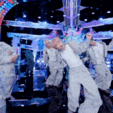 a group of people are dancing in front of a mirror with the words go on the bottom