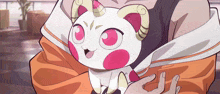 a cartoon drawing of a person holding a unicorn cat with horns