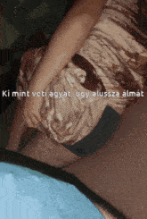 a person laying on a bed with the words ki mint veti agyat ugly alussza almat on the bottom