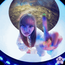 a woman is giving the middle finger in front of a circle that says look at lalisa