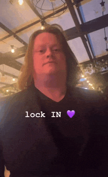 a man with a purple heart next to the word lock in