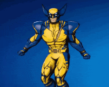 a statue of wolverine is standing on a blue background