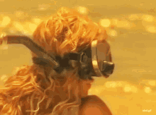 a gif of a woman wearing a diving mask with the url rbd.gif on the bottom