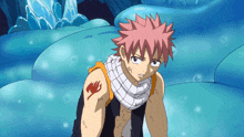 a fairy tail character with a scarf around his neck and a tattoo on his arm