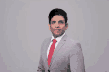 a man in a suit and tie is surrounded by bubbles of different colors