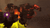 a blurred image of a person holding a gun with a red light coming out of it