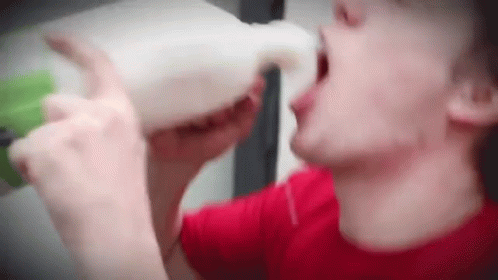 Chugging Milk Pouring Milk GIF - Chugging Milk Pouring Milk Spilling Milk Over Self GIFs