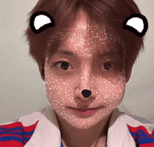a close up of a person 's face with a bear mask on