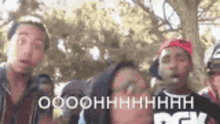 a group of young men are standing next to each other and one of them is wearing a dgk shirt