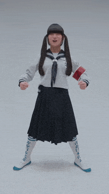 a girl in a school uniform is dancing