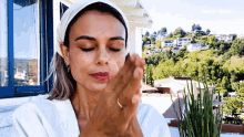 Massaging Face Nathalie Kelley GIF - Massaging Face Nathalie Kelley Marie Claire GIFs