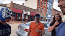 a group of men are standing in front of a building that says gym