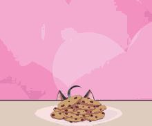 a cat girl with a bell around her neck is looking at a plate of cookies