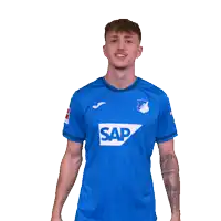 a young man wearing a blue shirt with the word sap on it
