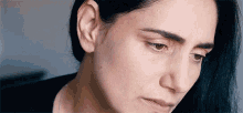 a close up of a woman 's face with her eyes closed and her mouth open .