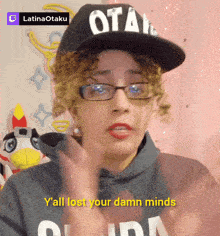 a woman wearing glasses and a hat that says otaku on it
