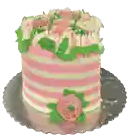 a pink and white striped cake with flowers on it