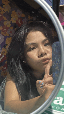 a woman taking a picture of herself in a mirror with the word foam on the bottom