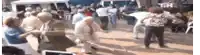 a group of older people are dancing in a crowd .