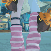 a girl wearing pink and white striped socks stands in front of a fantasy fair
