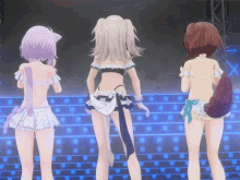 three anime girls are standing on a stage and one has a tail
