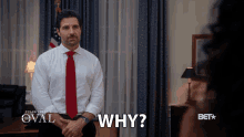 a man in a white shirt and red tie is asking the question " why "