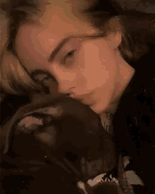 a close up of a woman 's face with a dog 's head on her shoulder