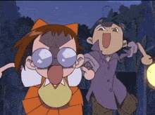 a boy and a girl are standing next to each other and the girl is wearing glasses