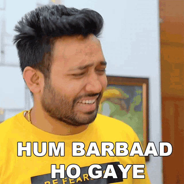 a man wearing a yellow shirt with the words hum barbaad ho gayae on it