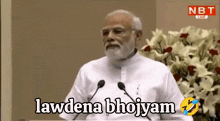 a man with a beard is giving a speech with the words lawdena bhojyam on the screen behind him