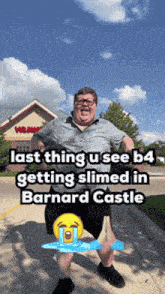 a man standing in front of a building with the words last thing u see b4 getting slimed in barnard castle above him