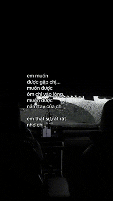 a black and white photo of a car with the words em muon được gặp chị