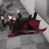 a person with red hair and a red cape is falling down