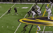 a football game is being played on a field with the letters sb nation at the bottom