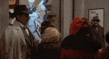 a group of people are standing in front of a poster that says cincinnati on it