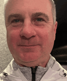 a close up of a man 's face and neck