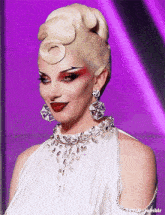 a woman is wearing a white dress and earrings and has a purple background behind her that says tumblr