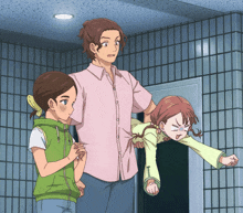 a man in a pink shirt is carrying a little girl on his shoulders