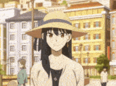 a woman wearing a straw hat and a necklace with a s on it