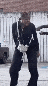 a tiktok video of a person dancing with a purse